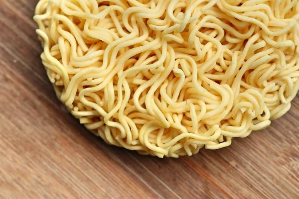 dried instant noodles on wooden
