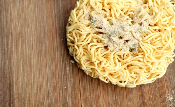 dried instant noodles on wooden