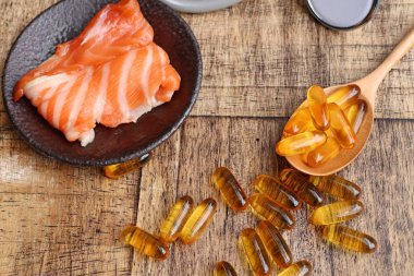 Balık yağı kapsülleri ile taze balık