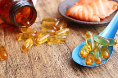 Balık yağı kapsülleri ile taze balık