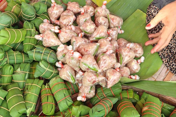 Pork wrapped in banana leaves — Stock Photo, Image