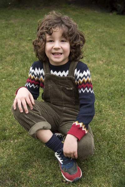 Little Boy Curly Hair Tooth Posing Green Bib — 스톡 사진