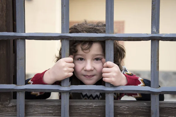 Smiling Little Boy Locked Iron Fence — 스톡 사진