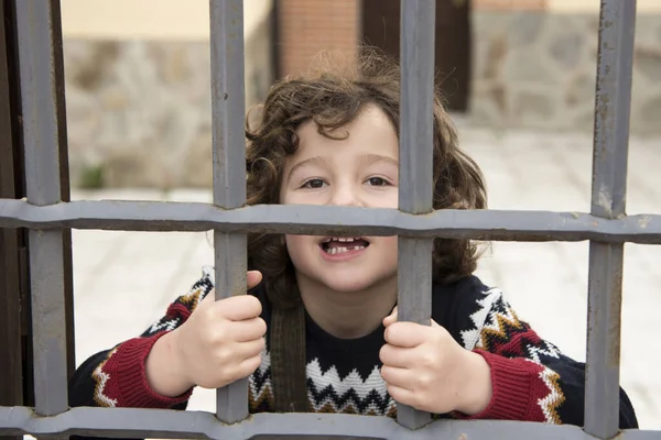 Smiling Little Boy Locked Iron Fence — 스톡 사진