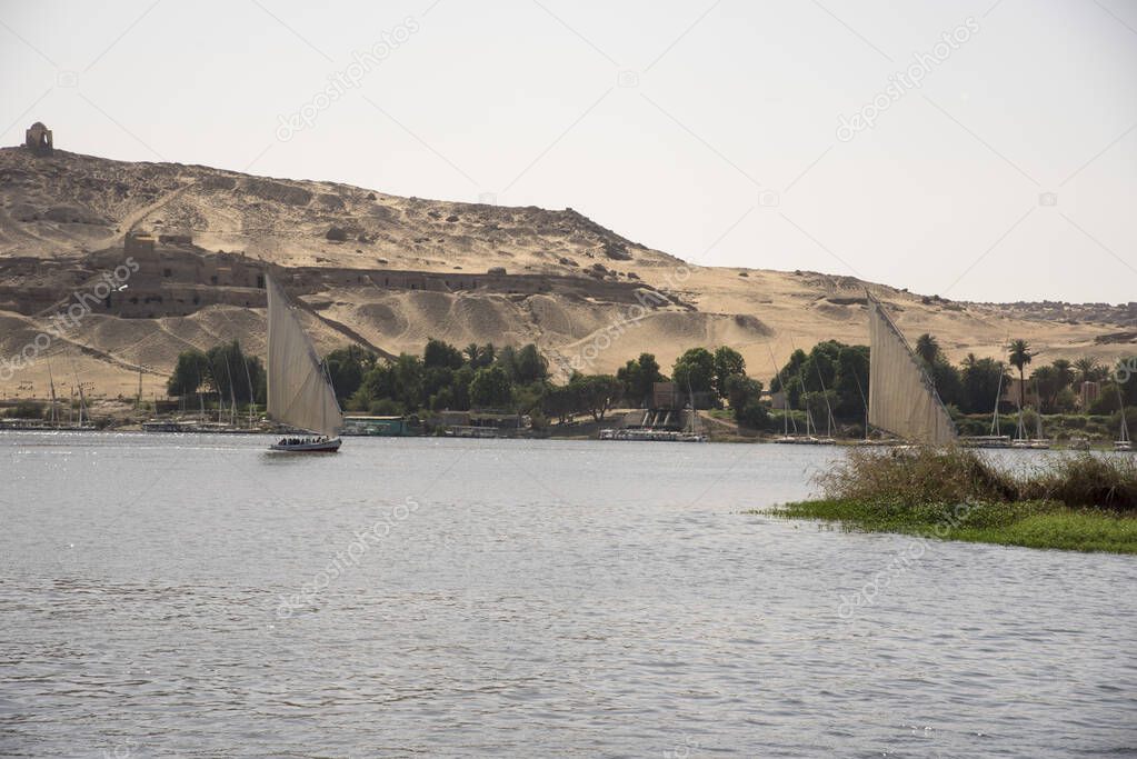 Feluccas on the Nile river in aswan Egypt on a hot day