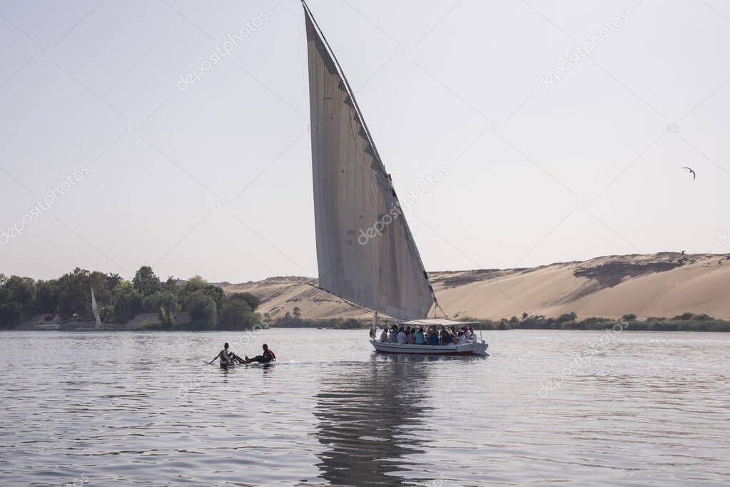 Feluccas on the Nile river in aswan Egypt on a hot day