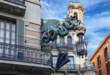 Barcelona. Chinese dragon on House of Umbrellas  clipart