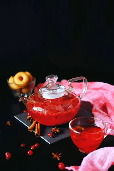 Cranberry herbal hot tea drink in glass teapot with cinnamon and — Stock Photo, Image