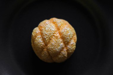 Japonya 'da Şeker Popüler ile kaplı gevrek kurabiye hamuruyla kaplı Yumuşak Ekmek' Kavun Ekmeğinin Taklit Yaşamı