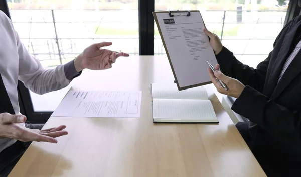 Job seeker talking and presentation about himself with interview employee for job interview in the office, Job applications concepts.