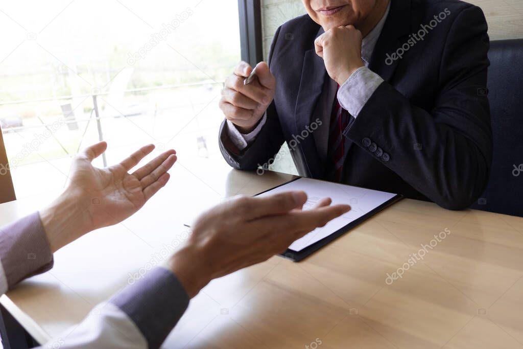 Job seeker talking and presentation about himself with interview employee for job interview in the office, Job applications concepts.
