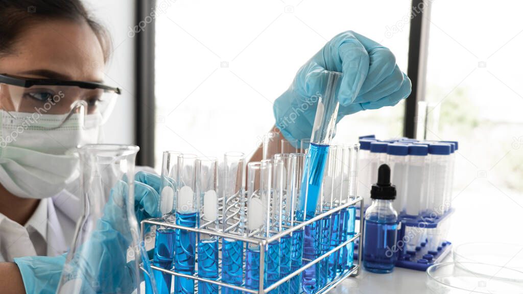 Female scientist are experimenting in the laboratory, science concept, virus, chemical.