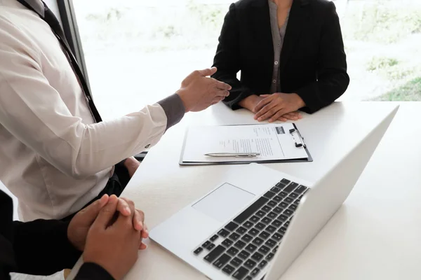 Interview employee talking about resume and job description with the job seeker sitting in front, Job applications concepts.