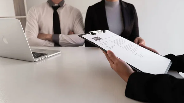 Interview employee talking about resume and job description with the job seeker sitting in front, Job applications concepts.