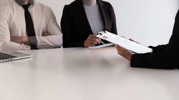 Interview employee talking about resume and job description with the job seeker sitting in front, Job applications concepts.