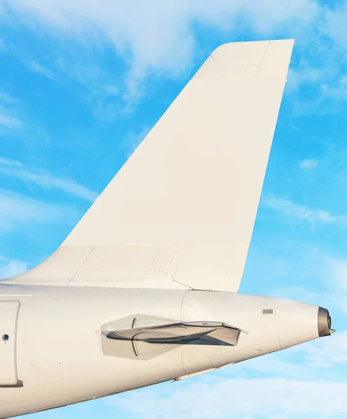 Plane tail fin - sky with white clouds in background — Stock Photo, Image