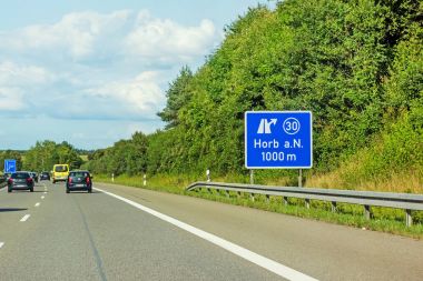 motoway road signs on (Autobahn 81 / A 81 / E 531) direction Stuttgart - exit to city Horb am Neckar clipart