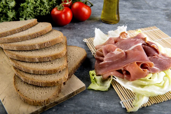 Italian snack with bread and parma ham — Stock Photo, Image