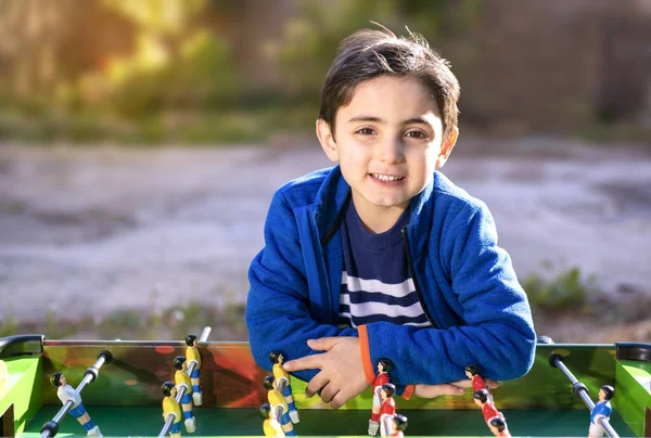 Child Plays Table Soccer Outdoor Setting — Stock Photo, Image