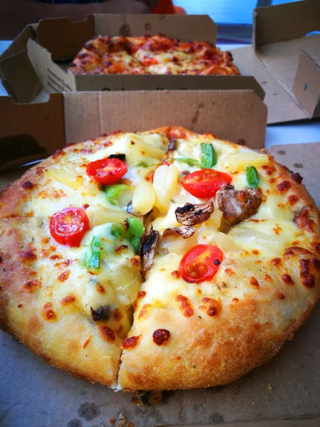 A delicious pizza in the box — Stock Photo, Image