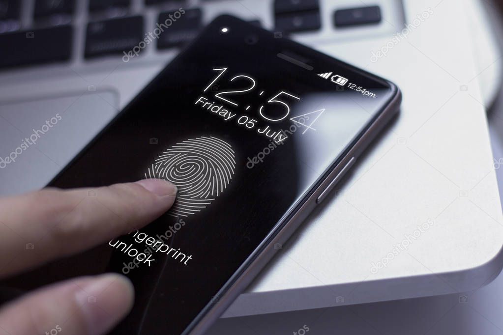 Finger touching smartphone to unlock screen.