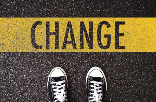 Black shoes standing at the road with change wording. — Stock Photo, Image