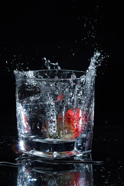 A splash of water in glass — Stock Photo, Image