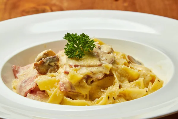 Carbonara pasta, pasta, meat, Italian dish, presentation and serving, menu, beautifully decorated dish, delicious food, tasty and hot pasta, greens, plate