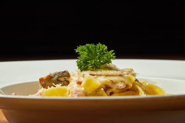 Carbonara pasta, pasta, meat, Italian dish, presentation and serving, menu, beautifully decorated dish, delicious food, tasty and hot pasta, greens, plate