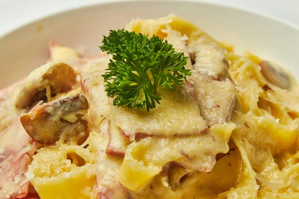 Carbonara pasta, pasta, meat, Italian dish, presentation and serving, menu, beautifully decorated dish, delicious food, tasty and hot pasta, greens, plate