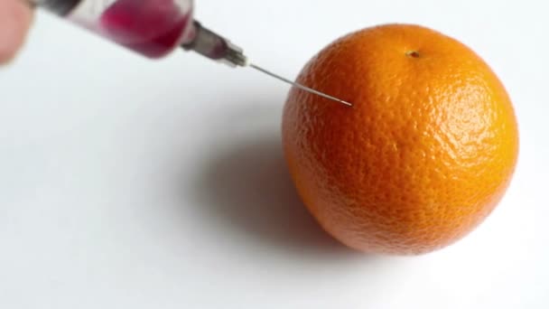 GMO injection with syringe in Orange — Stock Video