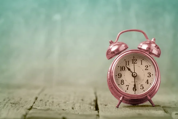 Alarm clock on table — Stock Photo, Image