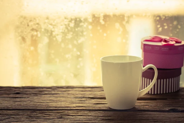 Coffee cup on a rainy — Stock Photo, Image