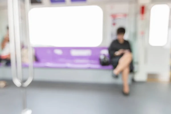 Blurred woman in train