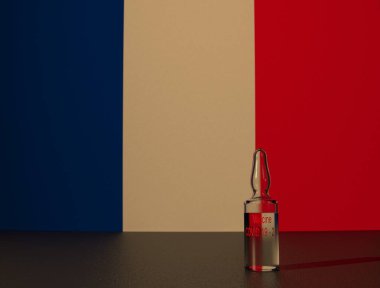 COVID 19 virüs aşısı Fransa bayrağının arka planına karşı. Yakın plan..