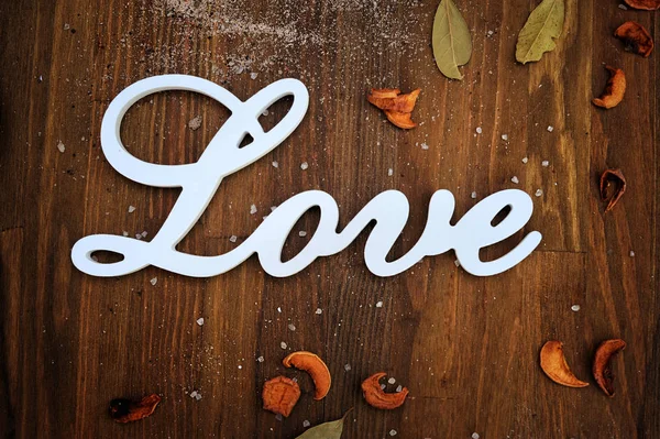 Love text card on wooden backdrop — Stock Photo, Image