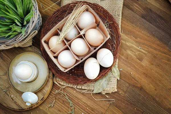 Fresh farm eggs on a wooden background — Stock Photo, Image