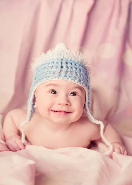 Beautiful happy and smiling baby lie on a stomach — Stock Photo, Image