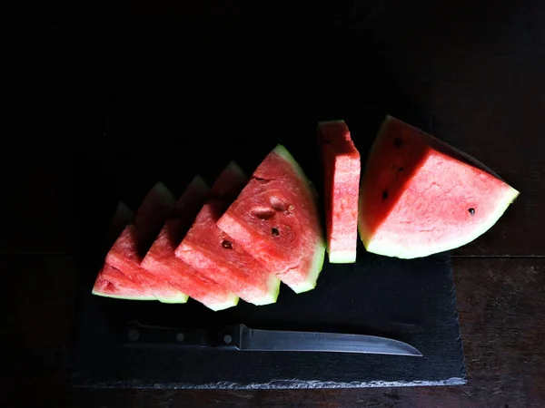 watermelon sliced on black background