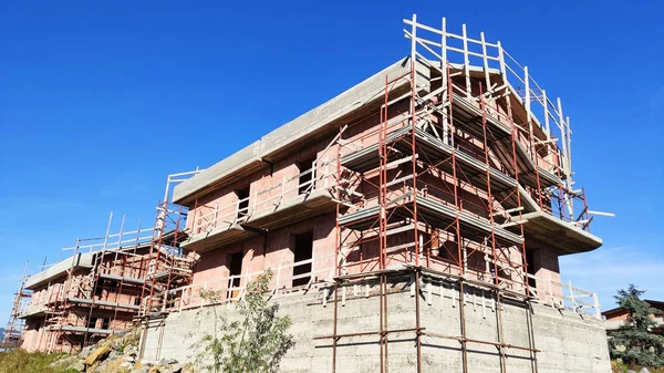 Reconstruction of block of houses with scaffolding