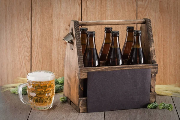 Craft beer from a wooden box. — Stock Photo, Image