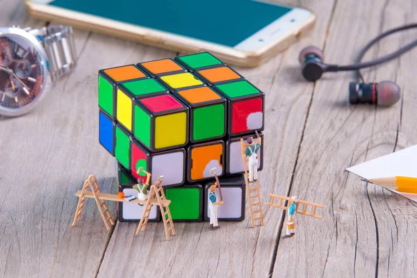 Little Figurine Painting Magic Cube Concept Teamwork — Stock Photo, Image