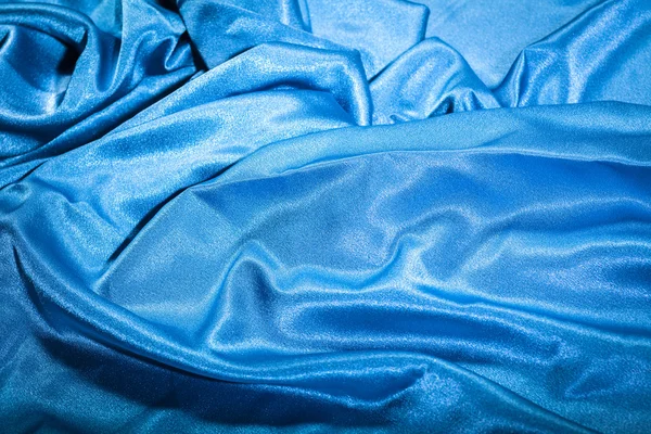 Primo piano parziale dei tessuti di seta blu — Foto Stock