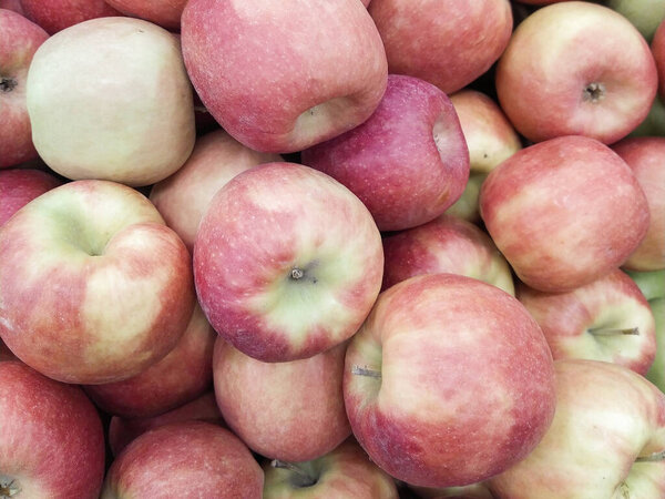 Group of red apples with their leaves. Close-up