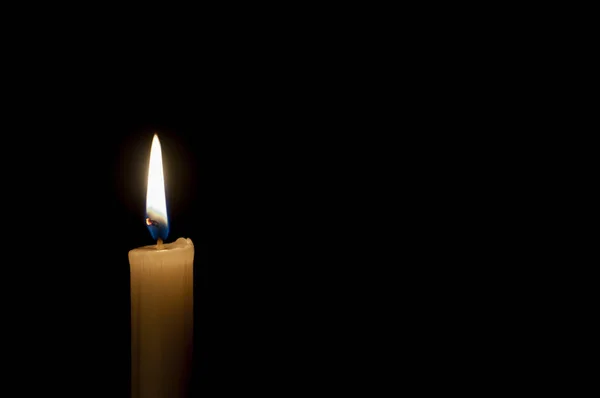 Candle on a black background Royalty Free Stock Photos