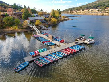 Aerial view of pier with small boat at Lake Cuyamaca, California, USA clipart