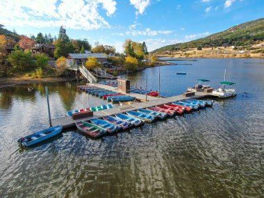 Aerial view of pier with small boat at Lake Cuyamaca, California, USA clipart