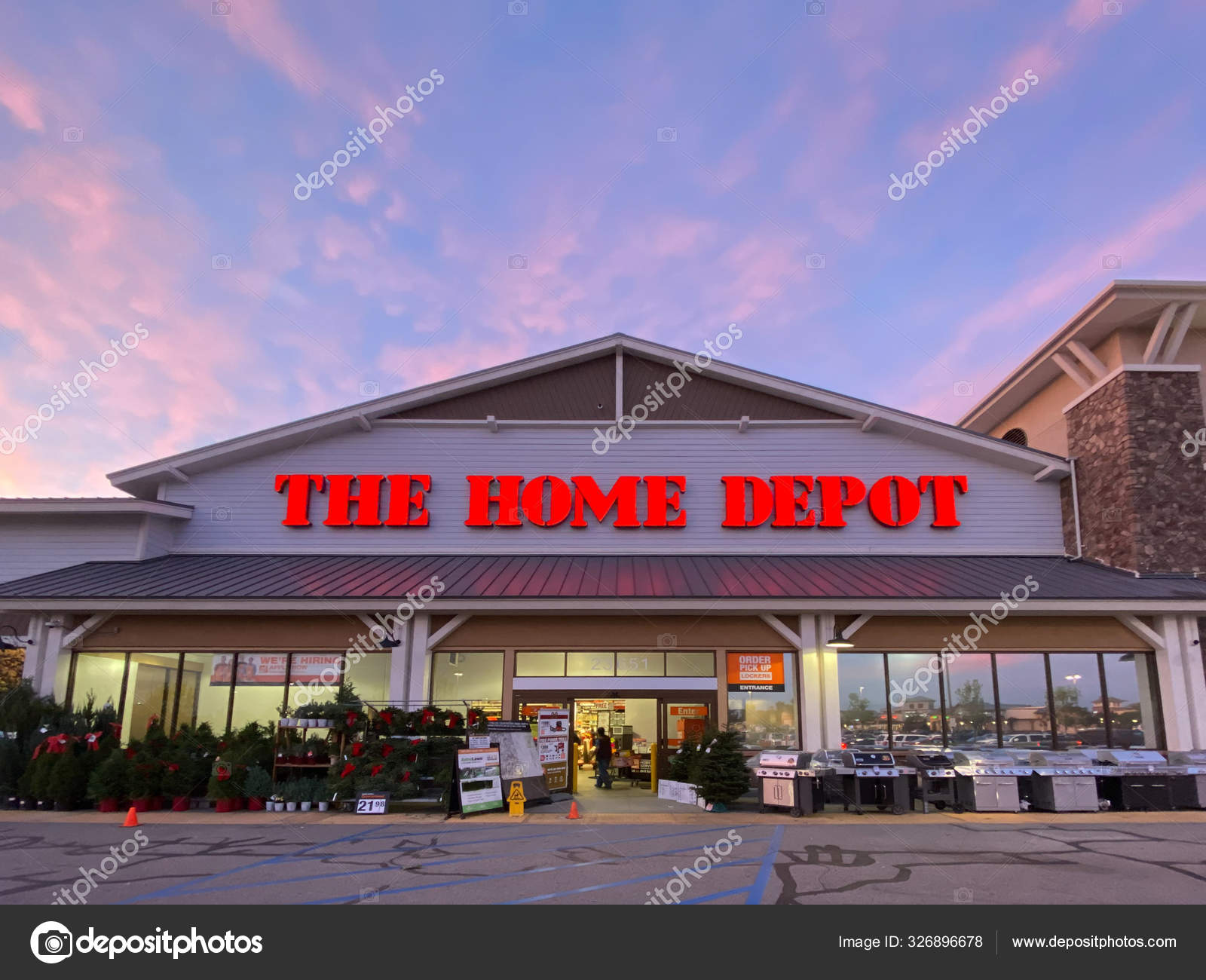 The Home Depot store entrance with colorful sunset in the