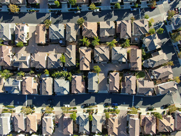 Aerial top view of upper middle class neighborhood with residential house next to each other in Chula Vista, California, USA.