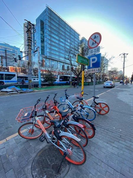 Rows of sharing bikes on the road in Beijing. China — 图库照片